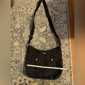 Black and Tan Handbag. Like new no wear or tear. Smoke free pet free. Used once